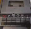 Sharp RD-771AV top-down view of cassette transport bay with Record, Play, Rewind, F Fwd, Stop/Eject, and Pause transport buttons