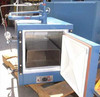 National Appliance Co 5840 vacuum oven with door open — stainless steel interior chamber with one removable shelf and perimeter door gasket seal visible