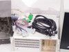 Lotus Technologies 7100 CSS tester system – close-up of rackmount computer unit with cable bundle including green DB connectors, ribbon cables, and braided power cables