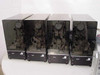 Lotus Technologies 7100 CSS tester modules – all four units side by side showing smoked acrylic enclosures with mechanical micro-gaging assemblies and dial indicators visible inside