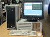 Lotus Technologies 7100 CSS system – system running with monitor showing CSS software interface with green graph traces, keyboard and mouse connected, confirming OS/2 boot and software operation