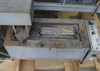 Technical Devices Mark I-C wave soldering machine – top-down view of solder pot section with cover removed, showing wave nozzle and heavy flux/solder residue buildup
