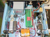 Interior of Staco SQ 1010 Variac cabinet — open top view showing GE transformer, green control PCB, red relay modules, solenoid valve bank, and internal wiring