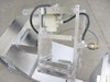 Mixing mechanism close-up – top-down view of the tilting mixing tray frame with motor and hydraulic/pneumatic cylinder assembly