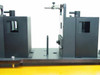 Applied Magnetics EL97083713 dual alignment modules on base plate — close-up of gap between the two fixture blocks showing apertures and guide pins