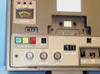 Wollensak 2873AV — left-side front panel close-up showing VU record level meter, tape counter, model label, mode selector buttons, and volume/record level knobs