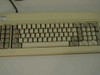 IBM 1503206 PC XT keyboard — top-down view of full key layout showing yellowed keycaps and IBM label on upper-left bezel