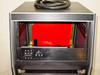 Interior upper rack section open showing empty rack rails, power control panel with switches and green indicator LEDs, and large power cable coiled on top