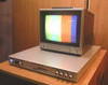 Nova 620S TBC rackmount unit with Panasonic monitor on top showing color bars output