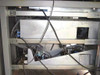 Nicolet 170-SX FTIR Spectrometer cabinet interior underside — electronics chassis, power supply modules, wiring harnesses, and cooling fan assemblies
