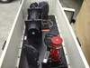 Nicolet 170-GC interior with lid open — optical rail with mirror and motor assemblies, red cylindrical MCT detector dewar, and wiring on black optical breadboard