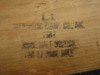 Close-up of stamp on wood pole reading U.S. Orthopedic Equip. Co. Inc. Ridge Half Section For 17 Foot Ridge