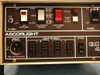 Ascorlight QC4A front panel close-up showing Flash switch, Charging Speed (Fast/Med/Slow), A/B channel selector switches, Ready lamp, Push to Flash button, Model On/Off switch, Light Output jacks for channels A, B, C, D, and Sync switch