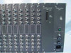 Vindicator PVS-648/8 rear panel close-up — VM-1 modules with BNC inputs, CM-1 data I/O D-sub connector, green power LED illuminated on PM-1, IEC power inlet