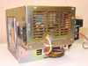 HP 0950-2035 power supply – left/bottom angle showing ventilation slots and output wire harness with Molex connectors