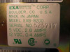 Exabyte EXB-8200 rating label close-up — MODEL EXB-8200, SERIAL NO. 525717, 5 VDC 2.8 AMPS, 12 VDC 0.4 AMPS, UL and CSA marks, Made in Japan
