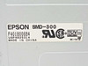 Epson SMD-300 label closeup showing model number, part number F401800684, USP4825314, UL, CSA, TÜV certifications, Made in China, and DC+5V 1A power rating