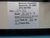 Microcom M-410 8 rating label close-up showing model number, serial number, manufacture date April 1995, 117V AC 60Hz 3.0A power specs
