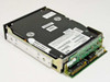 Imprimis 94208-75 60MB half-height IDE hard drive — left-side and rear angle showing green IDE/power controller PCB, drive mechanics, and warranty void seal sticker