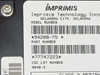 Imprimis Technology Inc. label close-up showing model number 94208-75, part number 77747223, and CSC lot number 9048-3 — Oklahoma City, Oklahoma