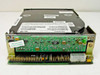 Imprimis 94208-75 half-height IDE hard drive — rear view showing 40-pin IDE connector, 4-pin Molex power connector, green PCB with ICs, and warranty void seal