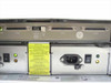 HP NetServer Rack Storage/8 rear panel — dual power supplies with IEC inlets and rocker switches, SCSI port array with Tray ID option switch and caution labels