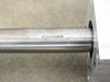 Close-up of Thomson-RL logo stamped on 1-inch diameter stainless steel RoundRail guide rod near aluminum bearing block