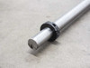 Thomson RoundRail 1" diameter guide rod — macro close-up of machined end face with center bore and black retaining collar detail