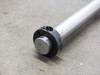 Close-up of the end cap and retaining collar on the Thomson RoundRail RL linear guide rod showing slotted collar detail