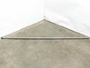 Thomson RoundRail RL 75-inch linear guide rod laid diagonally on concrete floor — full length view