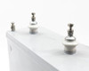 TOEI O82130 capacitor – close-up top view of three ceramic-insulated high voltage stud terminals with stainless hardware