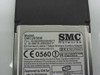 SMC Networks SMC2635W — rear label showing FCC ID HEDWN3304B17, IC ID, CE 0560 mark, and regulatory compliance text