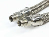 Close-up of the 1/8 inch male NPT end fittings on both Swagelok SS-FM4PM2PM2-12 stainless braided hoses showing stainless ferrules and threads