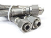 Swagelok FM Series SS braided hoses – angled view of both tube fitting ends with stainless braid visible and cable tie securing the pair