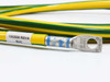 Close-up of BHC 1002636A part label (Rev A) and Panduit ring lug terminal with blue ferrule on yellow green cable