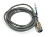 Yaskawa B4ICE-03A Sigma II servo power cable coiled showing full 3-meter length with circular connector and bare wire leads
