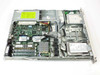 Compaq ProLiant DL320 interior view with lid removed showing motherboard, RAM modules, CPU with heatsink, hard drive, power supply, and floppy drive