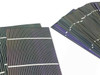 Solopower CIGS flexible solar cells fanned out showing thin-film front surface and blue-edged cells in two groups