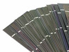 Edge-on fan view of Solopower CIGS flexible stainless steel solar cells showing ultra-thin profile and iridescent coating