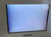 Panasonic AIGT2230H GT21 screen powered on showing blank white/blue backlit display with no content — touch unresponsive