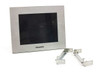Panasonic AIGT2230H GT21 programmable display front view with stainless steel bezel and two metal mounting brackets alongside