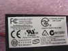 Askey V1456VQL-P1(INT) modem board label showing FCC ID H8NTAI-40049-M5-E, rating 5Vdc 300mA, CE and UL marks