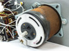 Rear view of SE Variac toroidal autotransformer coil showing copper winding and white plastic brush assembly