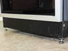 Rackmount cabinet base detail – leveling feet and lower chassis frame, showing surface scuffs on front base panel