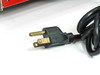 HP 6281A DC Power Supply – close-up of included AC power cord showing NEMA 5-15P plug with brass contacts