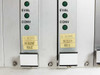 Zycad XP-140 card cage bottom detail showing two SM board front panels with EVAL and CONV LED indicators, gold serial number labels, and Rev C markings