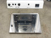 Hybaid MAXI 14 – top-down view of oven interior with door laid flat, showing stainless chamber floor and drive mechanism; front panel controls visible above