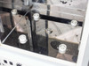 Hybaid MAXI 14 – interior top-down view showing drive rod, four white plastic bottle-holder clips, and stainless chamber walls