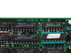 Peritek ASSY 104676 Rev A close-up of board silkscreen label with Texas Instruments SN74LS and SN74S series ICs