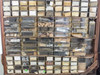 Wide view of center section of parts bins showing dozens of labeled drawers with small parts and hardware